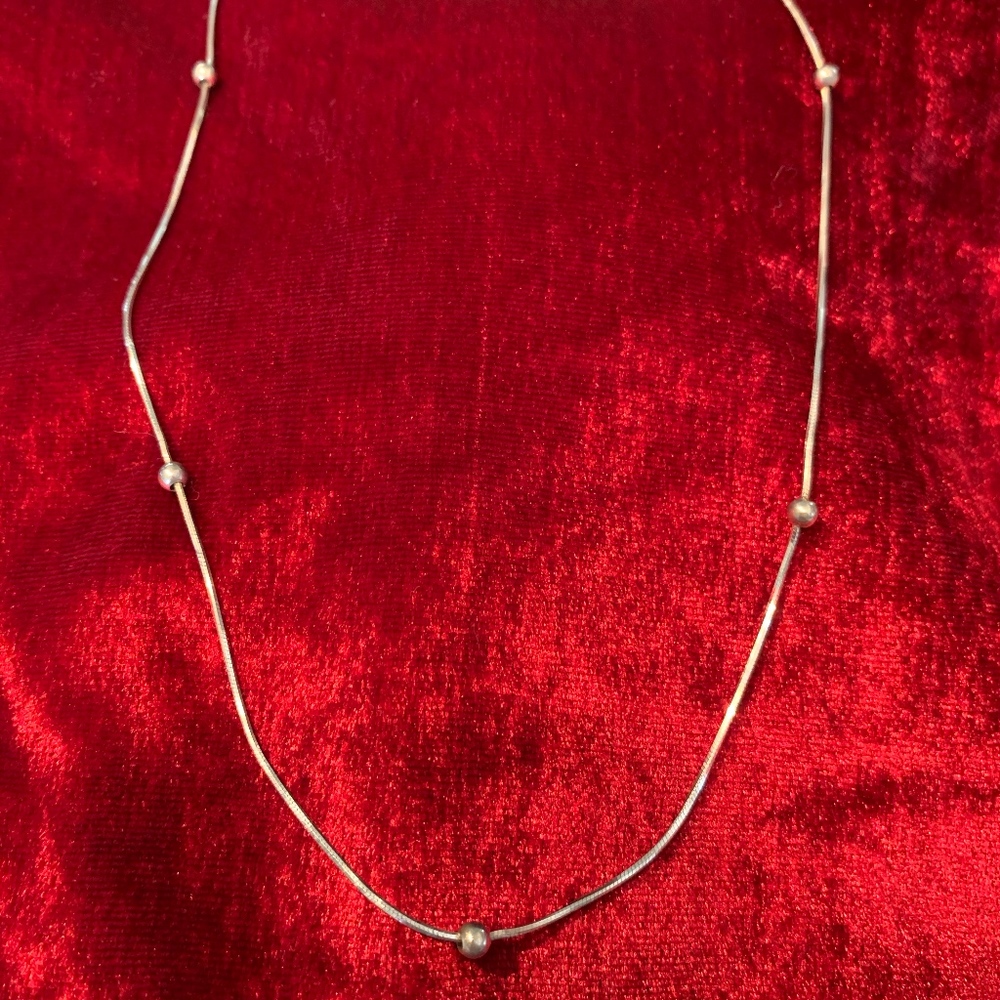 Silver necklace with silver beads, 18 inch length.